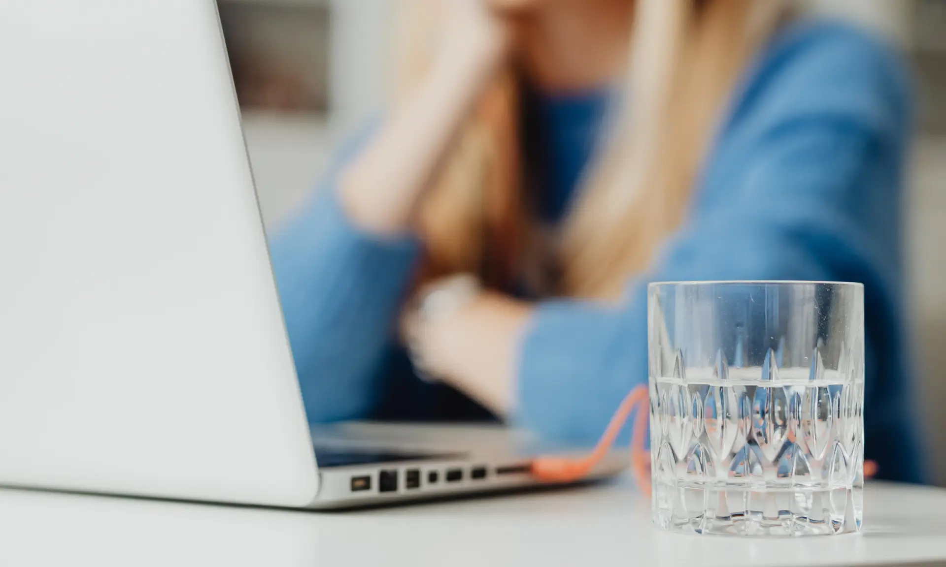 Woman sitting with water after taking the abortion pill